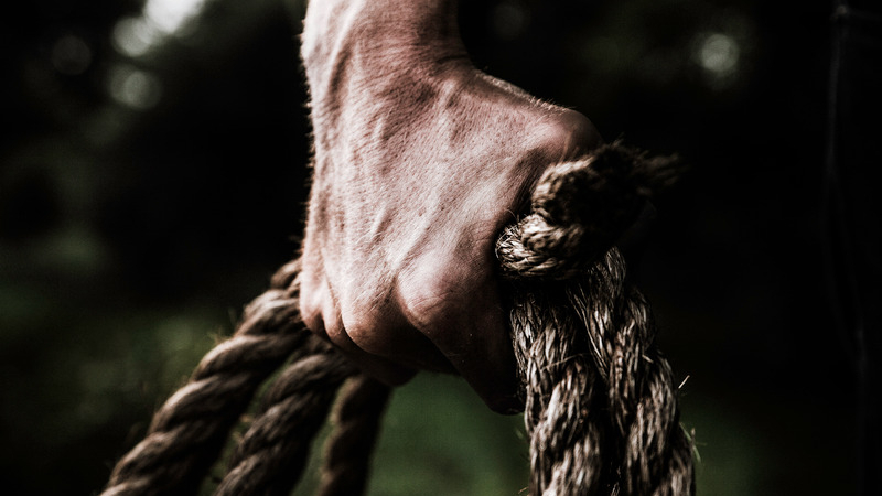 canva-man-holding-brown-rope